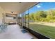 Covered patio featuring furniture set and screened enclosure overlooking backyard at 10626 Bonne Chance Dr, Orlando, FL 32832