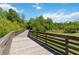 A lovely wooden trail amidst lush greenery at 10626 Bonne Chance Dr, Orlando, FL 32832