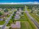 Aerial view of neighborhood, showing the home and neighboring residences at 107 Carlisle Ct, Kissimmee, FL 34758