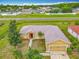 Inviting single-Gathering home with a neatly kept lawn, lovely trees, and a convenient attached two-car garage at 107 Carlisle Ct, Kissimmee, FL 34758