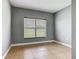 Bedroom features neutral walls, a window, and tiled floors at 107 Carlisle Ct, Kissimmee, FL 34758