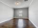 Bedroom featuring stylish wood floors, neutral walls, and natural light at 107 Carlisle Ct, Kissimmee, FL 34758
