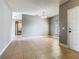 Versatile empty room showcasing tile flooring, neutral walls, and ample natural light at 107 Carlisle Ct, Kissimmee, FL 34758