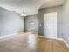 Blank canvas room featuring tile floors, soft gray walls, and a chandelier at 107 Carlisle Ct, Kissimmee, FL 34758