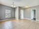 Open floor plan room featuring tile flooring, neutral walls, and a chandelier at 107 Carlisle Ct, Kissimmee, FL 34758
