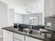 Kitchen island with stainless steel sink and granite countertops at 107 Carlisle Ct, Kissimmee, FL 34758