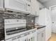 Close up of kitchen appliances and backsplash at 107 Carlisle Ct, Kissimmee, FL 34758
