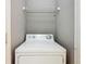 Laundry room featuring a white washer, and wire shelf on white wall at 107 Carlisle Ct, Kissimmee, FL 34758