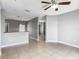 Open-concept living space featuring gray walls and tile floors at 107 Carlisle Ct, Kissimmee, FL 34758