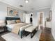 Tranquil bedroom features a plush bed, neutral tones, and easy access to a walk-in closet and bathroom at 107 Carlisle Ct, Kissimmee, FL 34758