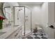 Bright bathroom featuring a vanity, toilet, and glass enclosed shower with stylish tile flooring at 112 Southern Pecan Cir # 201, Winter Garden, FL 34787