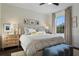 Serene bedroom with large window, soft lighting, and cozy bedding, creating a restful retreat at 112 Southern Pecan Cir # 201, Winter Garden, FL 34787