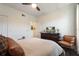 Relaxing bedroom featuring a TV, comfortable seating, and a cozy bed, creating a welcoming retreat at 112 Southern Pecan Cir # 201, Winter Garden, FL 34787