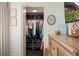 Organized walk-in closet with shelving for shoes, hanging clothes, and storage baskets for maximum storage at 112 Southern Pecan Cir # 201, Winter Garden, FL 34787