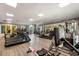 Well-equipped gym featuring treadmills, weights, and mirrored walls for fitness enthusiasts at 112 Southern Pecan Cir # 201, Winter Garden, FL 34787