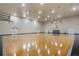 Spacious indoor gymnasium with polished hardwood floors and basketball hoops at 112 Southern Pecan Cir # 201, Winter Garden, FL 34787