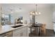 Open-concept kitchen overlooking dining and living areas, featuring stainless steel appliances at 112 Southern Pecan Cir # 201, Winter Garden, FL 34787