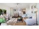 Open-concept living space with natural light, modern decor, and view of the kitchen and dining areas at 112 Southern Pecan Cir # 201, Winter Garden, FL 34787
