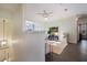 Open living room with ceiling fan, recessed lights and view into seating area at 112 Southern Pecan Cir # 201, Winter Garden, FL 34787