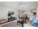 Spacious living room featuring an open floor plan with adjacent dining and kitchen areas at 112 Southern Pecan Cir # 201, Winter Garden, FL 34787