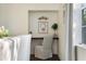 Charming office nook features an attached desk, decorated chair, and serene, clean decor at 112 Southern Pecan Cir # 201, Winter Garden, FL 34787