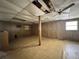A large, unfinished basement with natural light at 122 Laurel Dr, Sanford, FL 32773