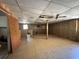 Spacious basement with a drop ceiling and wood paneling at 122 Laurel Dr, Sanford, FL 32773