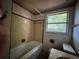 The bathroom includes a bathtub, sink, toilet, and window at 122 Laurel Dr, Sanford, FL 32773