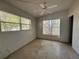 This bedroom has two windows providing plenty of light and features a ceiling fan for comfort at 122 Laurel Dr, Sanford, FL 32773