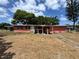 Single story home with a small covered porch and needing repairs in an established neighborhood on a sunny day at 122 Laurel Dr, Sanford, FL 32773