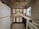 Features of the kitchen include white cabinets, a window, and an oven at 122 Laurel Dr, Sanford, FL 32773