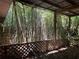Cozy covered outdoor space with a lush bamboo backdrop at 122 Laurel Dr, Sanford, FL 32773