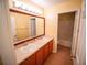 A simple bathroom with a double sink vanity and an adjoining shower-tub combo provides great convenience at 1870 Vale Dr, Clermont, FL 34711