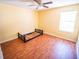 Bright bedroom with wood floors and natural light is a blank canvas for your personal style at 1870 Vale Dr, Clermont, FL 34711