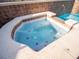 Attached hot tub provides a soothing retreat beside the sparkling pool at 1870 Vale Dr, Clermont, FL 34711
