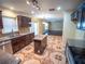 Open kitchen featuring an island, stainless steel appliances, and decorative tile flooring at 1870 Vale Dr, Clermont, FL 34711