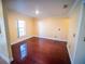 Inviting living room with polished hardwood floors and ample natural light at 1870 Vale Dr, Clermont, FL 34711