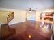 Open living room with hardwood floors, staircase, and kitchen access at 1870 Vale Dr, Clermont, FL 34711