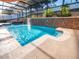 Tranquil pool boasts a waterfall feature, creating a relaxing outdoor experience at 1870 Vale Dr, Clermont, FL 34711
