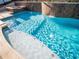 This dazzling pool area features a spill-over spa and a tanning ledge at 1870 Vale Dr, Clermont, FL 34711