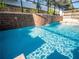 Sparkling pool with waterfall feature provides a serene backyard oasis at 1870 Vale Dr, Clermont, FL 34711