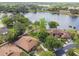 Aerial view showcasing the property's lakefront location and surrounding lush landscaping and neighborhood at 194 Heron Bay Cir, Lake Mary, FL 32746