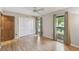 Bedroom featuring light wood floors, a ceiling fan, a closet, and two windows at 194 Heron Bay Cir, Lake Mary, FL 32746