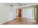 Bedroom featuring wood floors, a ceiling fan, a closet, and access to the bathroom at 194 Heron Bay Cir, Lake Mary, FL 32746