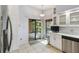 Bright kitchen featuring stainless steel appliances, ample cabinetry, and a sliding door to outdoor area at 194 Heron Bay Cir, Lake Mary, FL 32746