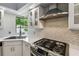 Modern kitchen featuring stainless steel appliances, a stylish backsplash, and sleek countertops at 194 Heron Bay Cir, Lake Mary, FL 32746