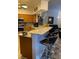Modern kitchen with granite countertops, breakfast bar, and stainless steel appliances at 19430 Sw 100Th Loop, Dunnellon, FL 34432