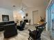 Spacious living room filled with natural light, stylish furniture, and luxury flooring at 19430 Sw 100Th Loop, Dunnellon, FL 34432