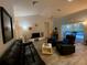 Spacious living room filled with natural light, stylish furniture, and luxury flooring at 19430 Sw 100Th Loop, Dunnellon, FL 34432