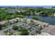 Beautiful aerial view of condos near a lake, surrounded by trees, parking, and landscaped grounds at 200 Maitland Ave # 153, Altamonte Springs, FL 32701